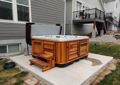 uncovered hot tub arctic spas in red cedar cabinet